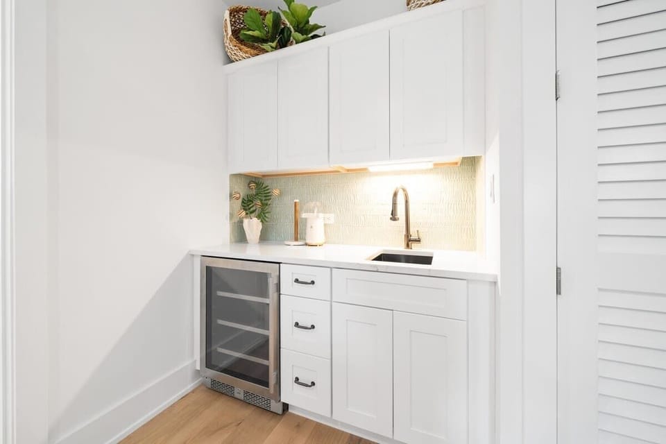 Stock the Wine Fridge, or Rinse Your Coffee Cup at the Second Floor Entertainment Room Wetbar