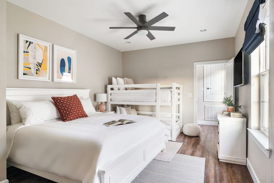 Bedroom 6 features a king bed, twin bunk bed and an ensuite bathroom.