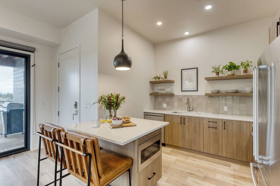 Modern kitchen with island seating and sleek finishes.
