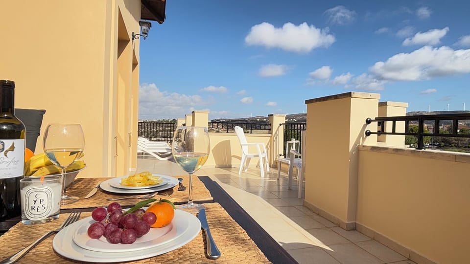 large terrace with subeds and barbeque