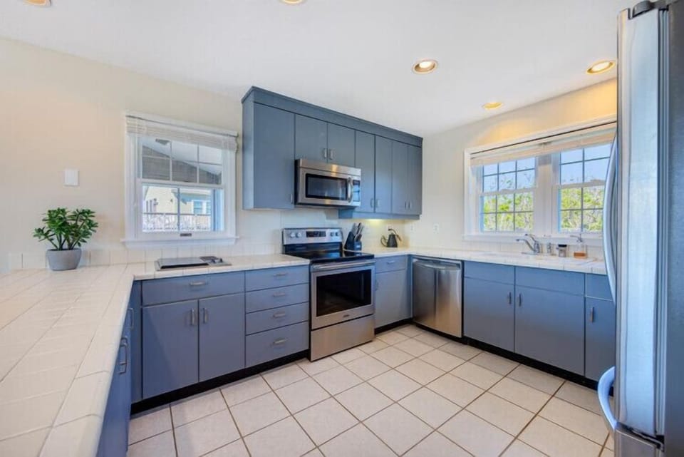 Your fully equipped kitchen features modern appliances, plenty of counter space, and natural light—perfect for preparing meals during your stay.
