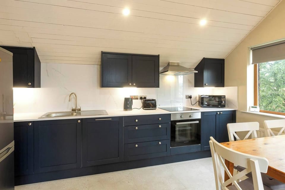 New kitchen supplies with all essentials such pots and pans and cutlery.