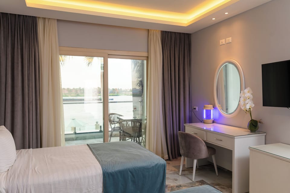 Standard Double or Twin Room, River View | Blackout drapes, iron/ironing board, free WiFi