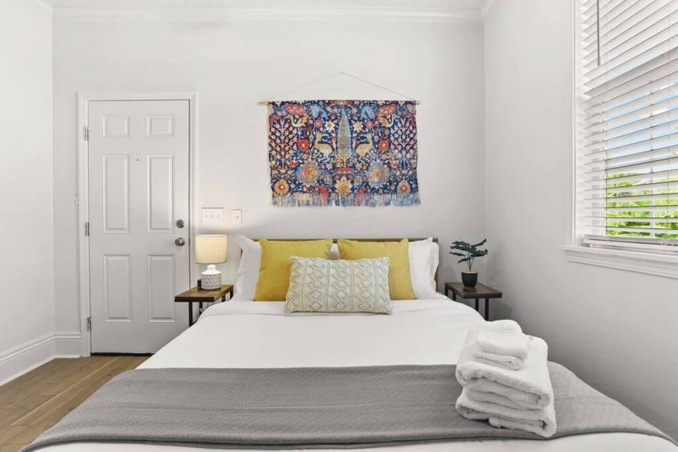 Master bedroom with Roku TV, comfy queen bed, full en suite bath & access to porch and backyard