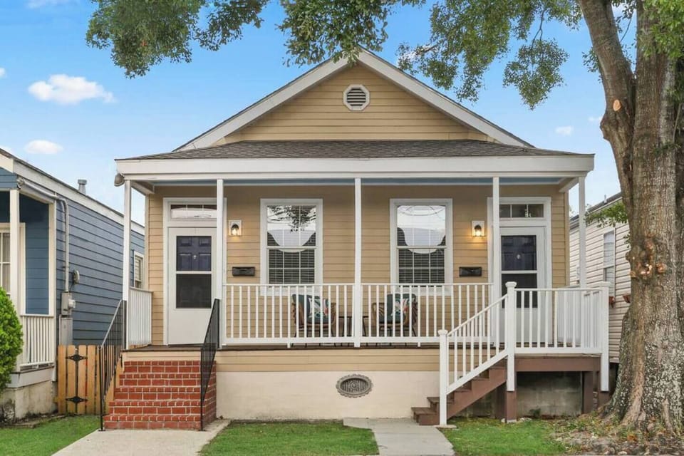 Relax on your shady front porch as you chat with friendly neighbors and sip coffee or wine