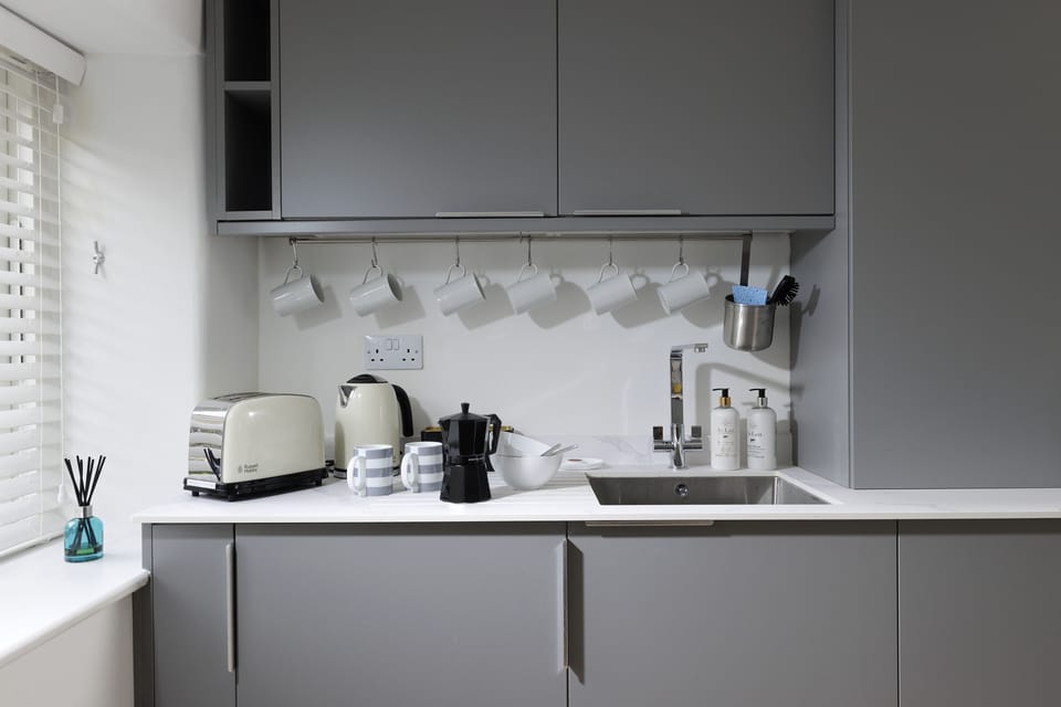 The kitchen offers a microwave, airfryer and stove top espresso maker