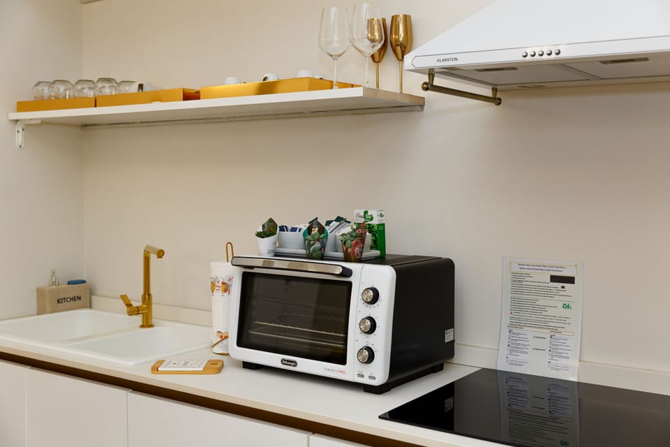Fridge, microwave, electric kettle, cookware/dishes/utensils
