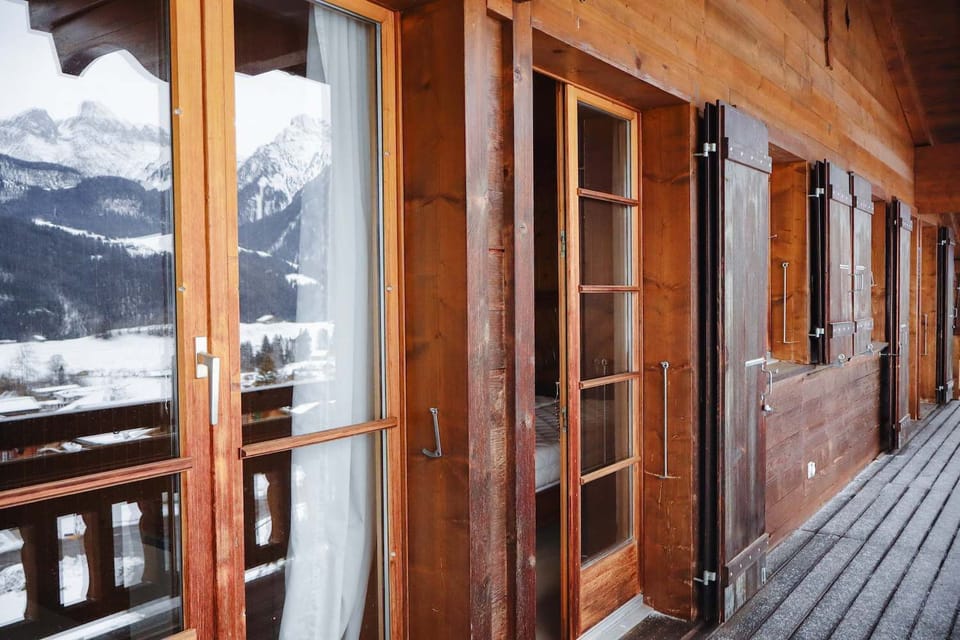 balcony doors with mountain reflection 