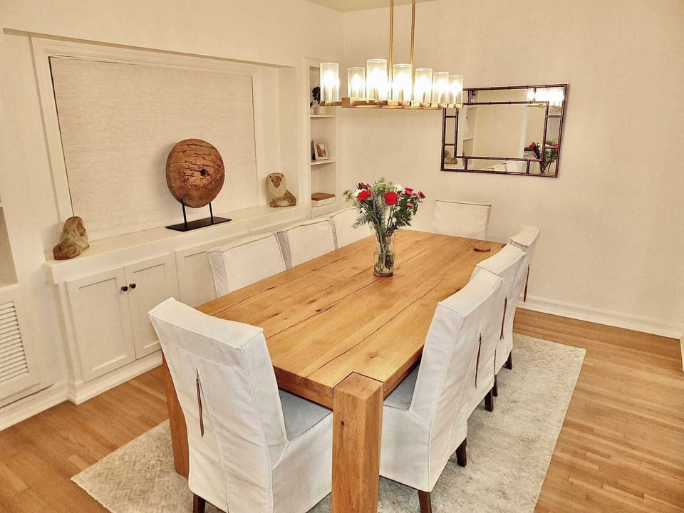 Gather for meals together at the chic dining table, seating 8