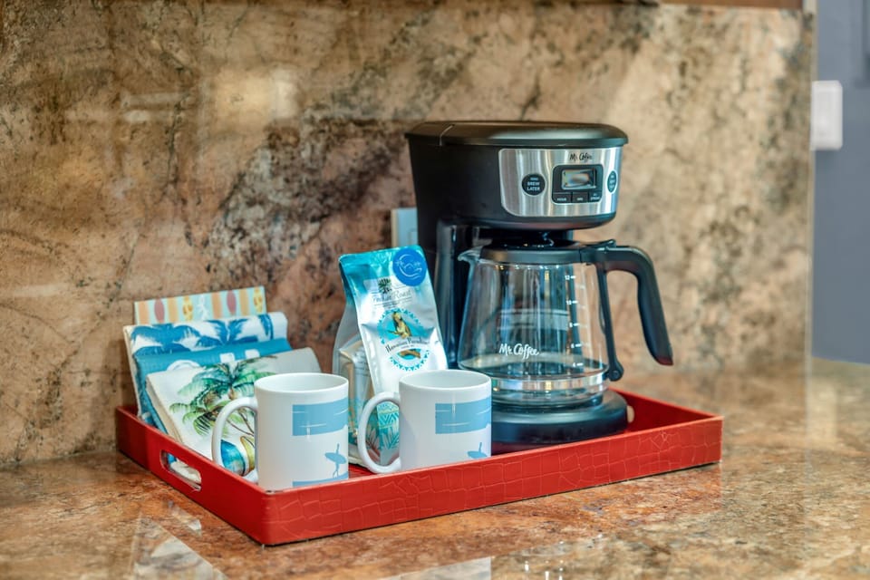 Drip Coffee Maker with reusable Gold Filter, Ground Coffee & Filtered Water Pitcher provided.