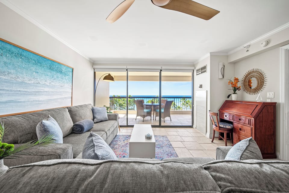 Enjoy a modern, open-concept living room with stunning ocean-inspired décor.