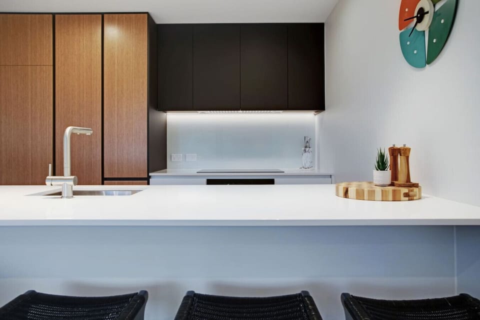 There is a handy kitchen island that doubles as a casual breakfast bar seating area.