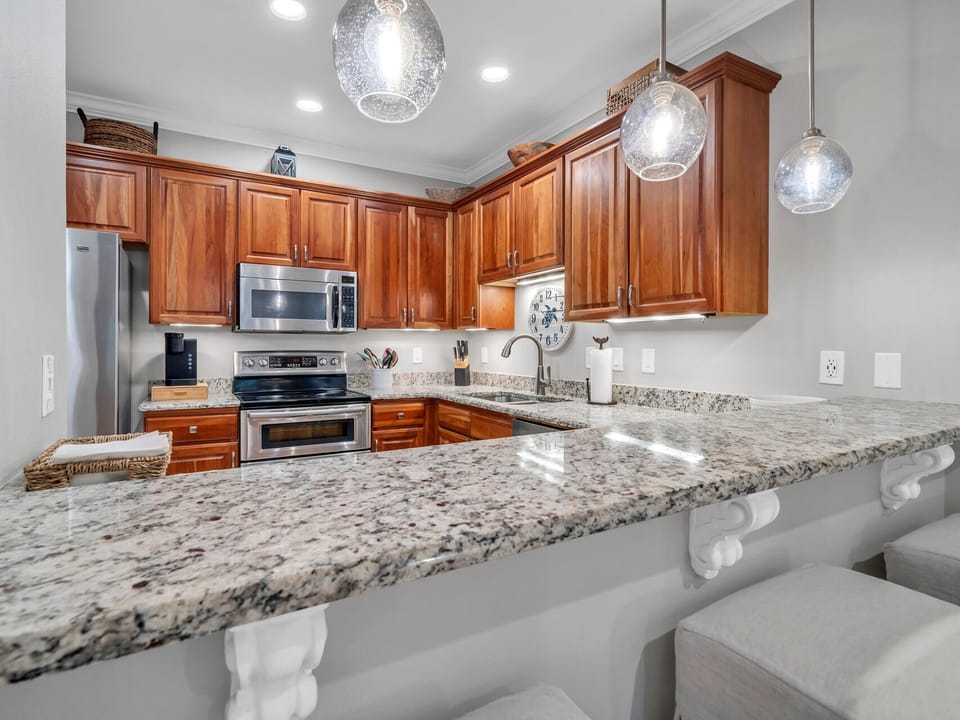 Your gourmet kitchen awaits with granite counters, cherry cabinets, and stainless appliances ready for culinary adventures.