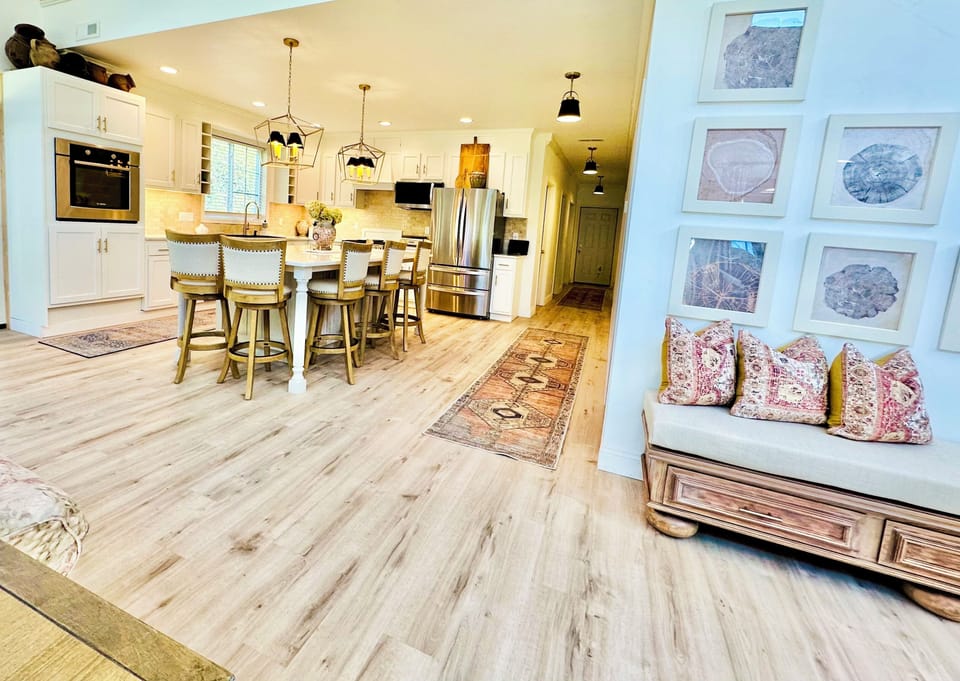 Open concept kitchen, family, and dining room with 18 ft lofted ceilings