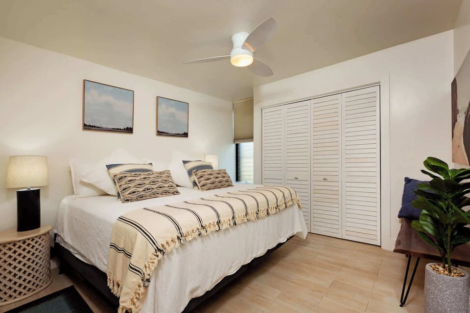 Drift to sleep in this serene bedroom retreat. Comfy bed, modern fan & ample closet space for a truly relaxing and unforgettable stay!