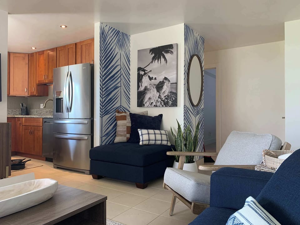 Enjoy seamless living! Our combined living room and full kitchen area offer comfort and convenience for your ideal vacation experience.