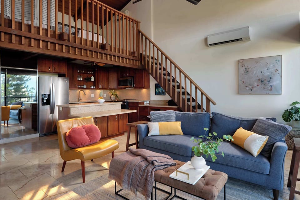 Open concept living at its best! Relax in comfort and enjoy easy access to the fully equipped kitchen.