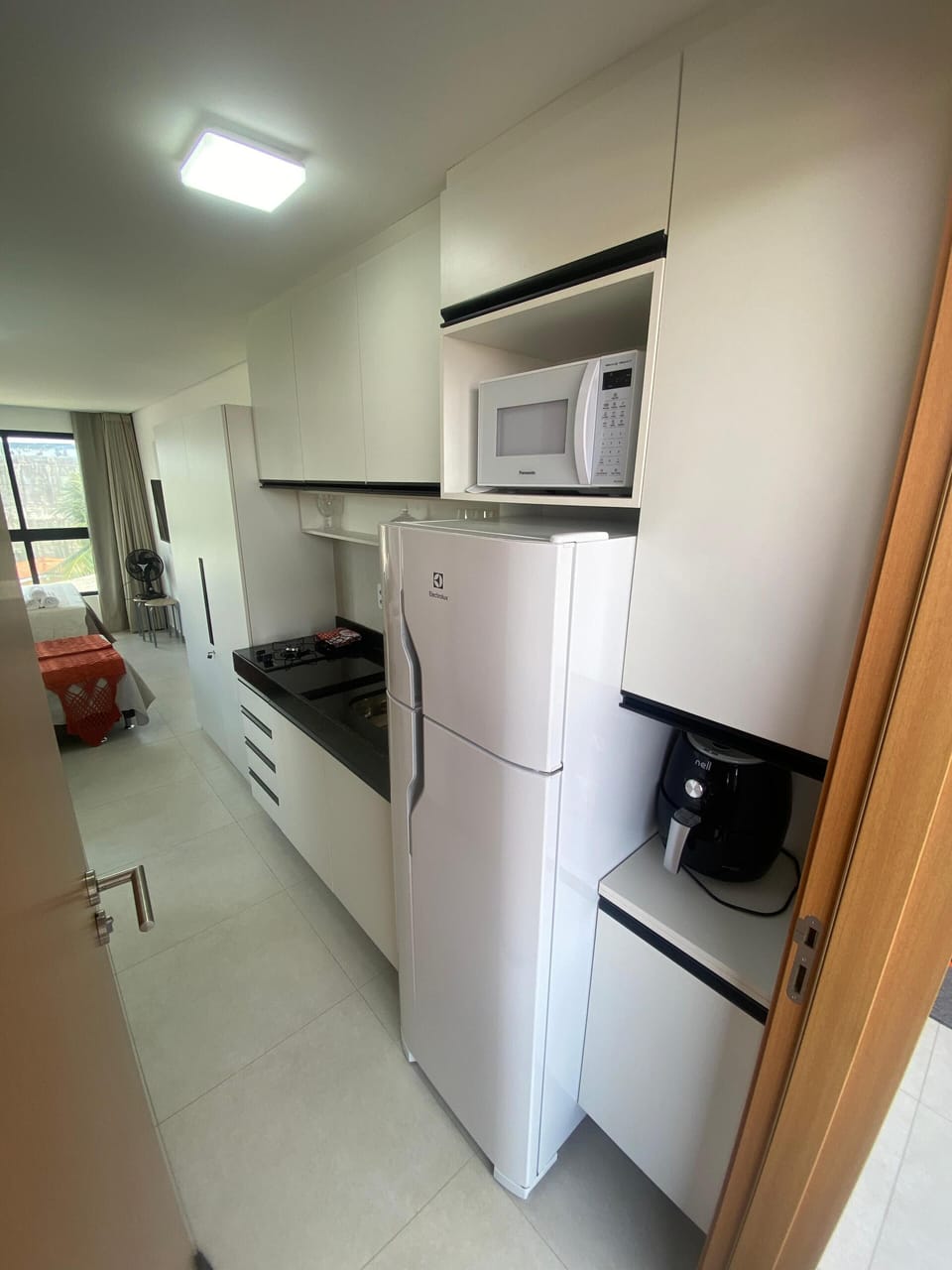 Fridge, microwave, stovetop, cookware/dishes/utensils