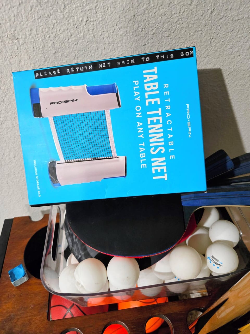 Please return ping-pong net back into box and all game items back in organizer.