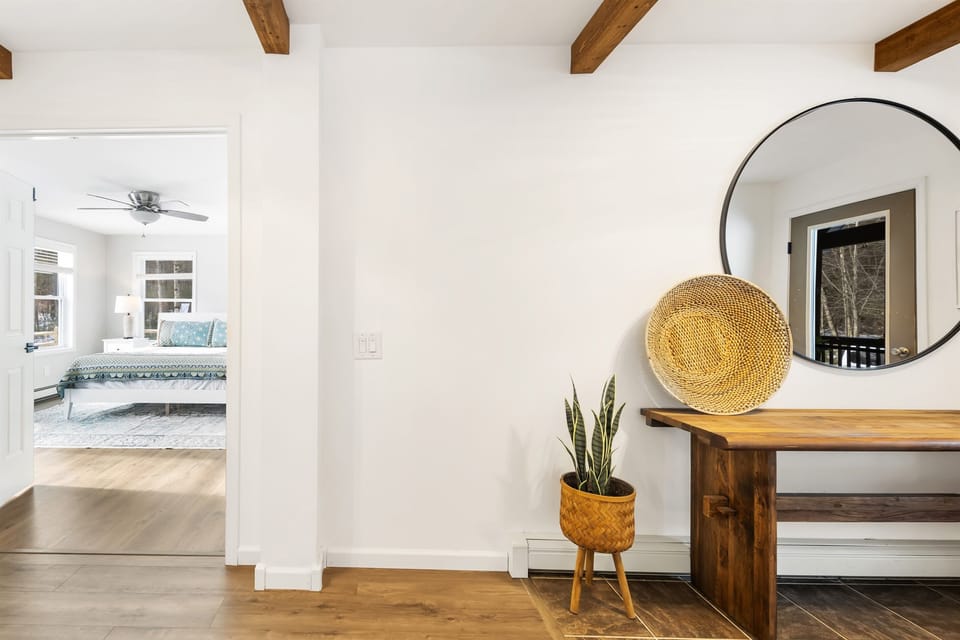 The stylish entryway leads to the beautiful master ensuite bedroom with a king bed. 