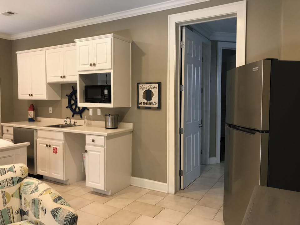 SECOND FULL SIZE FRIG, WET BAR WITH MINI FRIG, BLENDER, DISHES, SINK & MICROWAVE