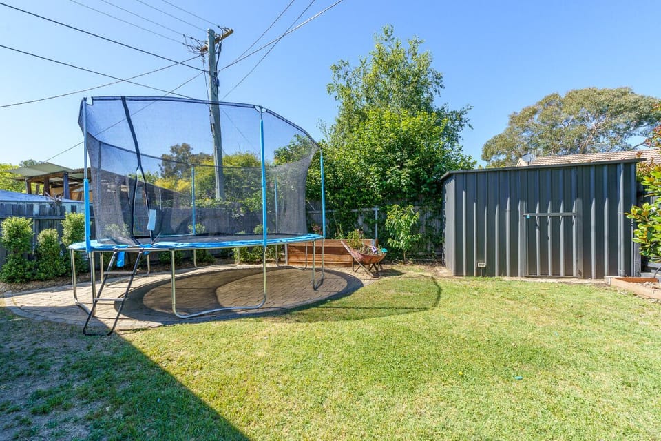Enjoy the trampoline and plenty of outdoor space for both play and relaxation.