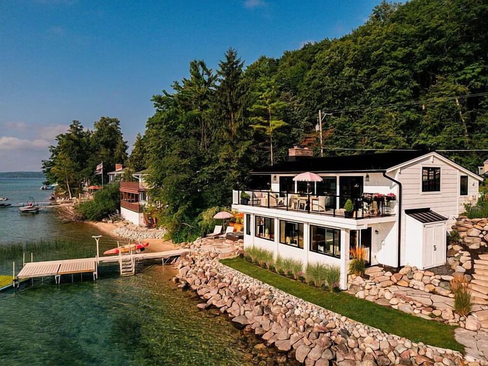 Our newly remodeled, luxuriously lavish lake house, complete with a private dock, spacious deck and stunning lake views is waiting just for you