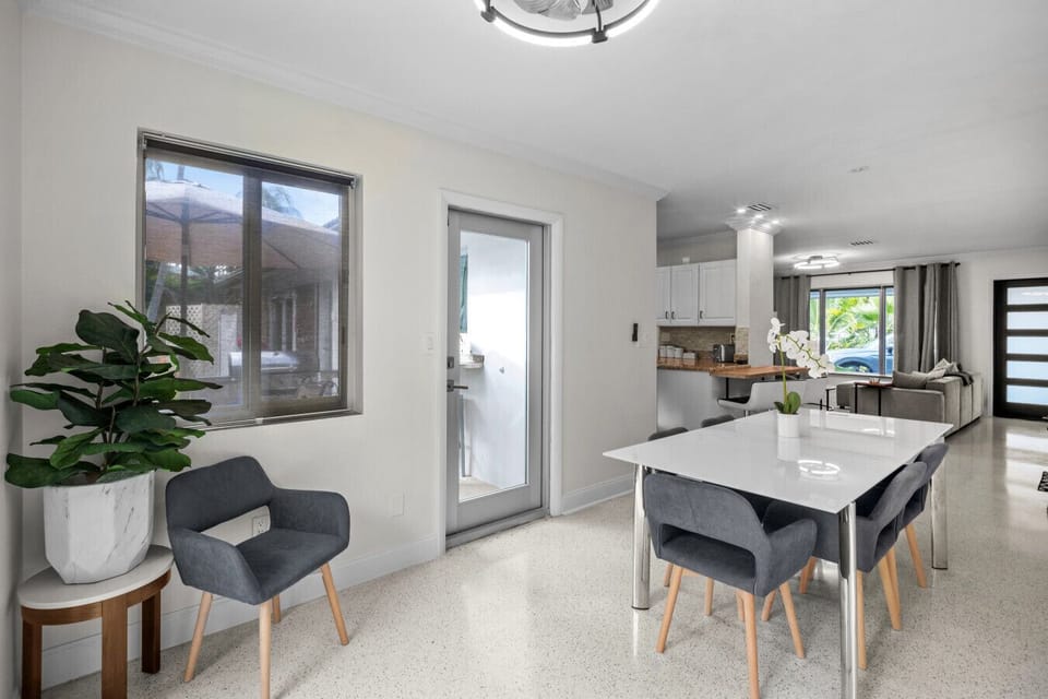 Open-concept dining area with plenty of natural light and modern flair