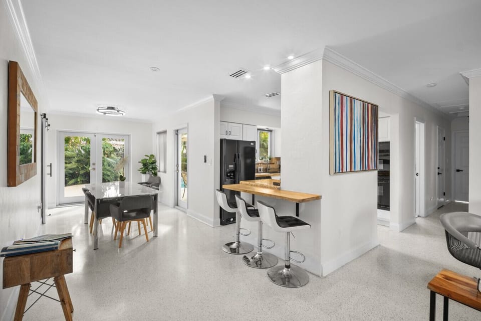 Open-concept dining area with plenty of natural light and modern flair