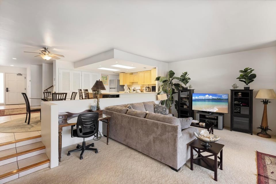 Enjoy the open floor plan connecting the living room and dining area, ideal for entertaining family or friends during your stay.