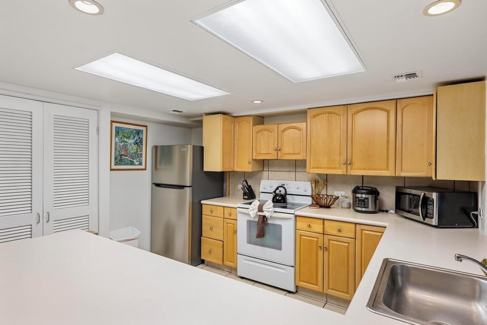 Cook up your favorites in this fully equipped kitchen, complete with modern appliances, ample counter space, and natural lighting.