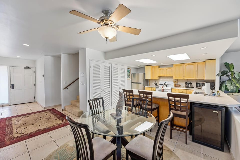 Prepare meals in this spacious kitchen with bar seating, offering the perfect spot for family or group dining experiences."