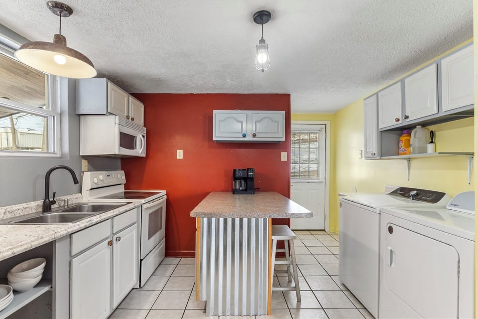 Washer and dryer with supplies.