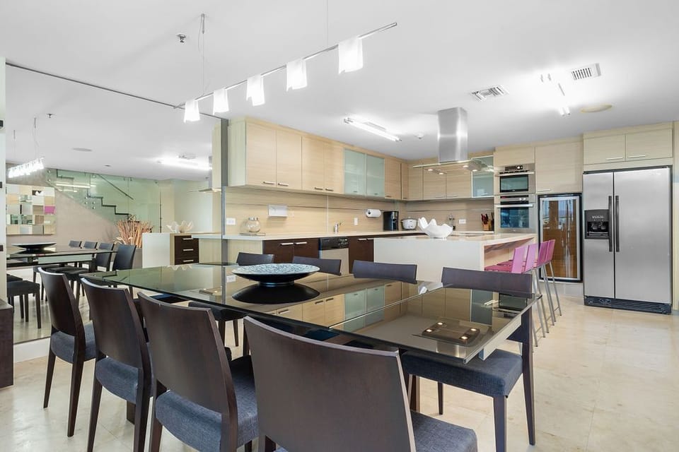 Ideal for family meals and entertaining, this dining area features an elegant 8-seating table, perfect for hosting gatherings and creating lasting memories. The spacious layout offers comfort and style for every occasion.