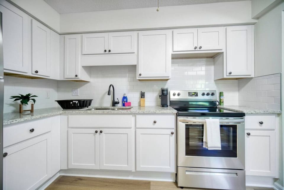 Fully equipped kitchen with modern appliances.