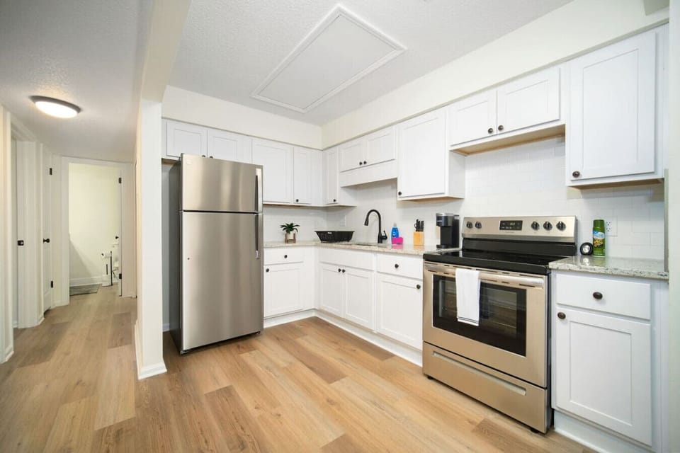 Fully equipped kitchen with modern appliances.