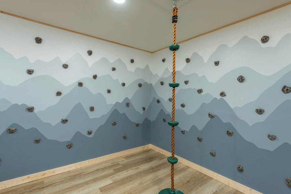 Adventure awaits indoors! The family room features a fun climbing wall and rope climb for kids (and adults!) to enjoy endless excitement.