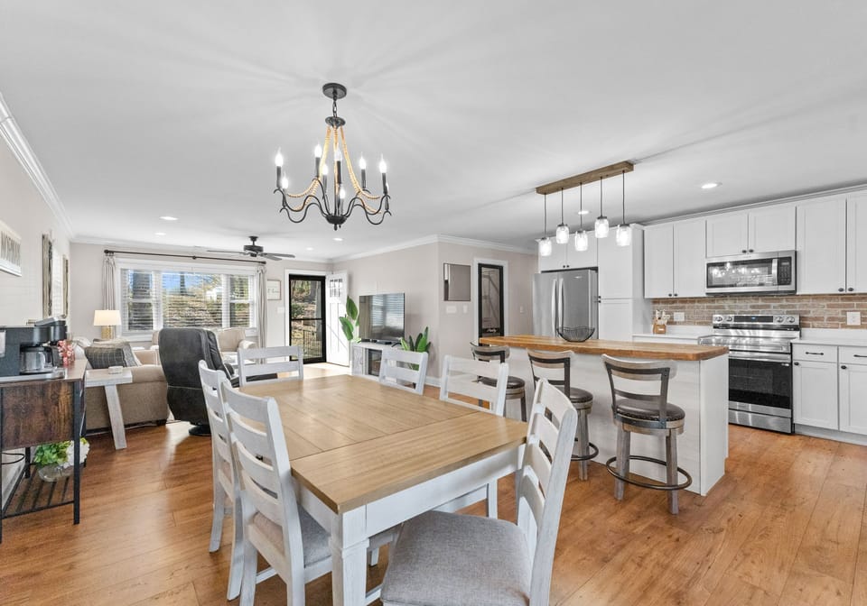 Open concept dining, living and kitchen areas. 