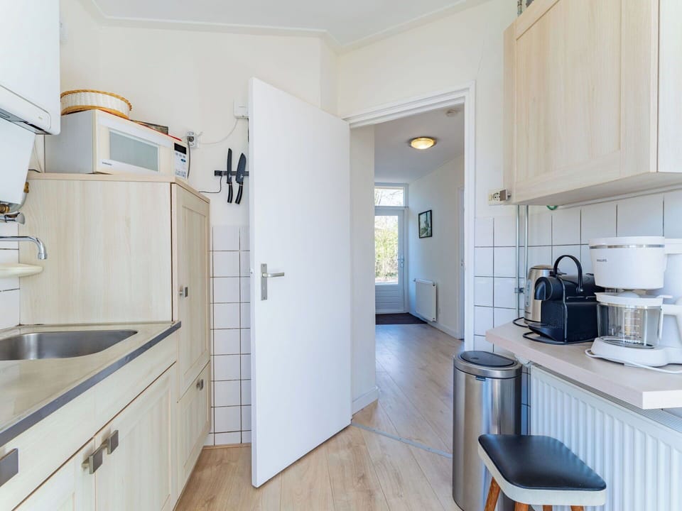 Kitchen, Flooring, Countertop, Major Appliance, Interior Design, Kitchen Appliance, Wood, Floor, Cabinetry, Ceiling