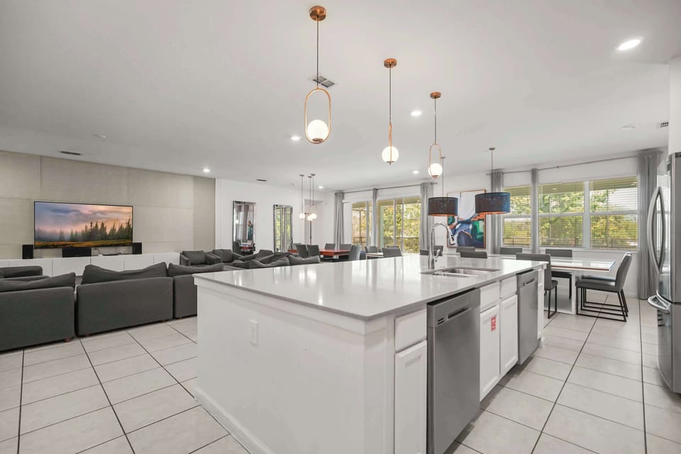 Experience luxury living with this expansive open-plan area, perfect for entertaining and relaxation, featuring a modern kitchen and cozy lounge.