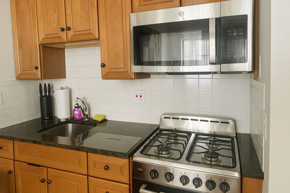 Clean sink area with dish soap and essentials provided