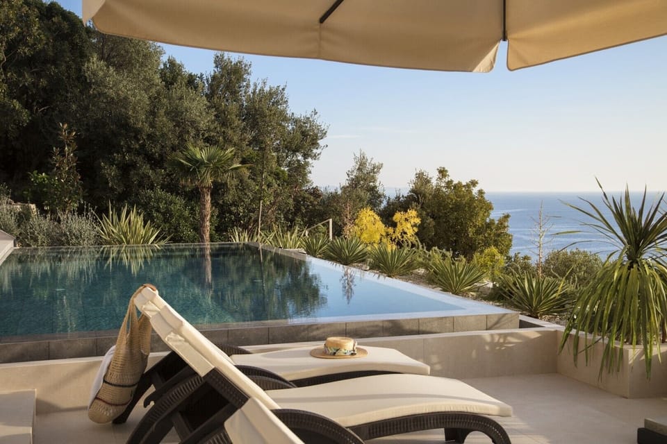 Patio with infinity heated pool, private garden, sun loungers and sea view in Luxury Rental Villa Energy Orebic - Peljesac 