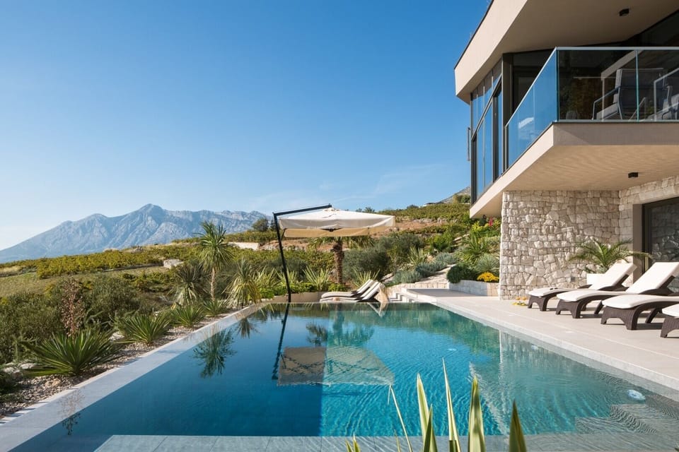 Patio with infinity heated pool, private garden, sun loungers and sea view in Luxury Rental Villa Energy Orebic - Peljesac 