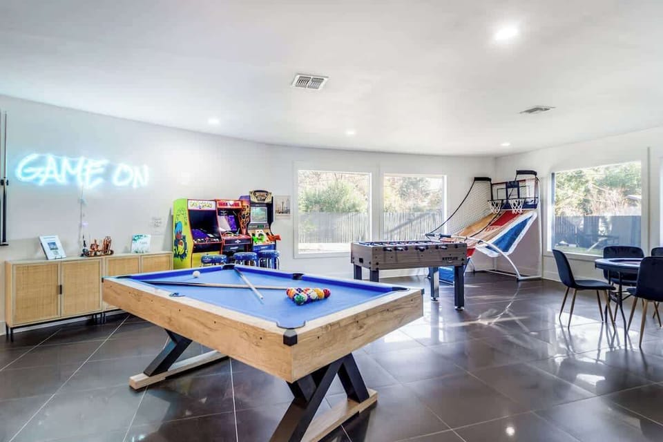 Iconic game room! Pool, Poker table, Foosball, Arcade Basketball, Pacman, NBA Jam, and Big Buck Hunter!