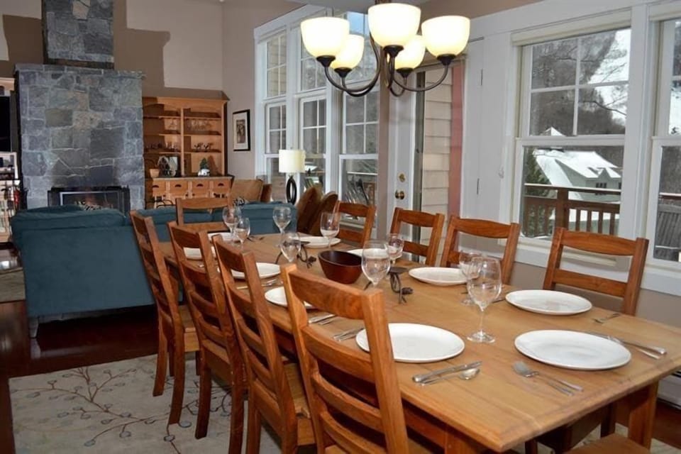 Meals can flow straight into conversation by the fire, with the dining area beside the living room.