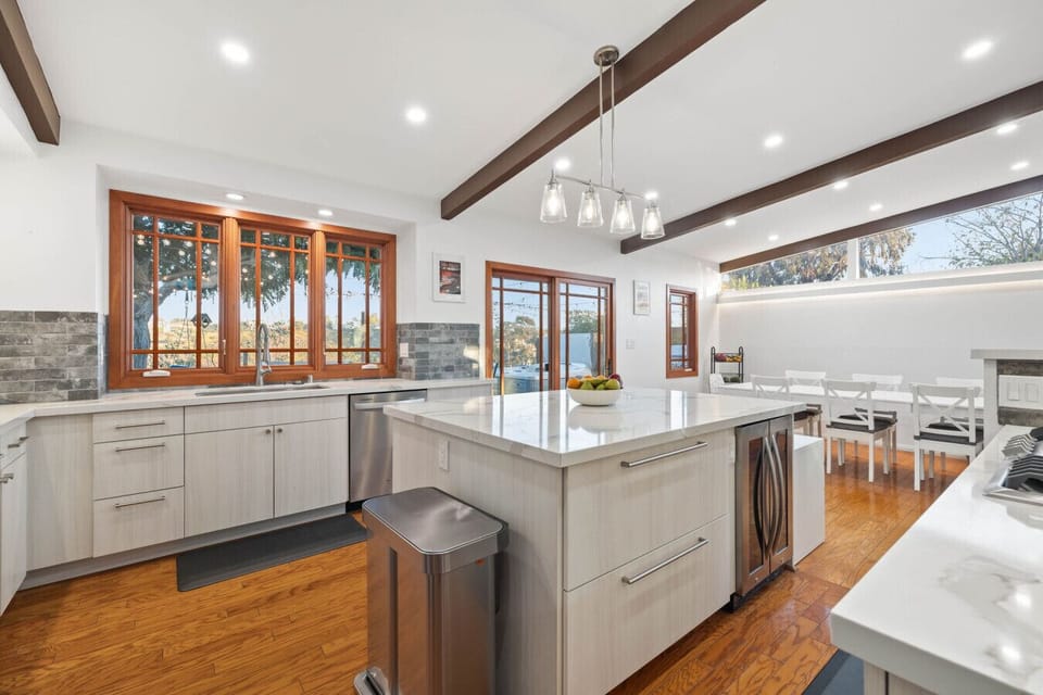 Bright kitchen with a marble island, ready for your culinary adventures.