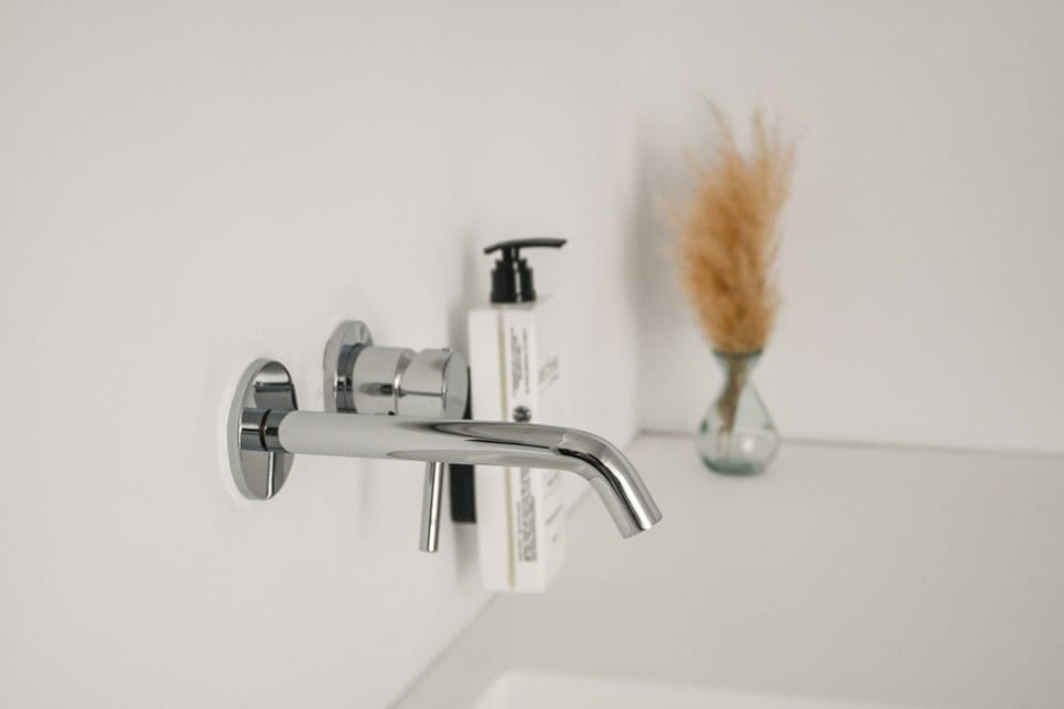 Shower, rainfall showerhead, hair dryer, towels