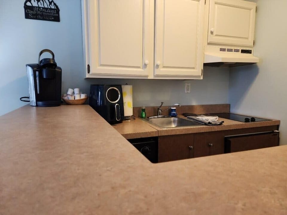 Kitchenette complete with Refrigerator, Stovetop, Dishwasher, Keurig, Airfryer, and all cooking utensils..