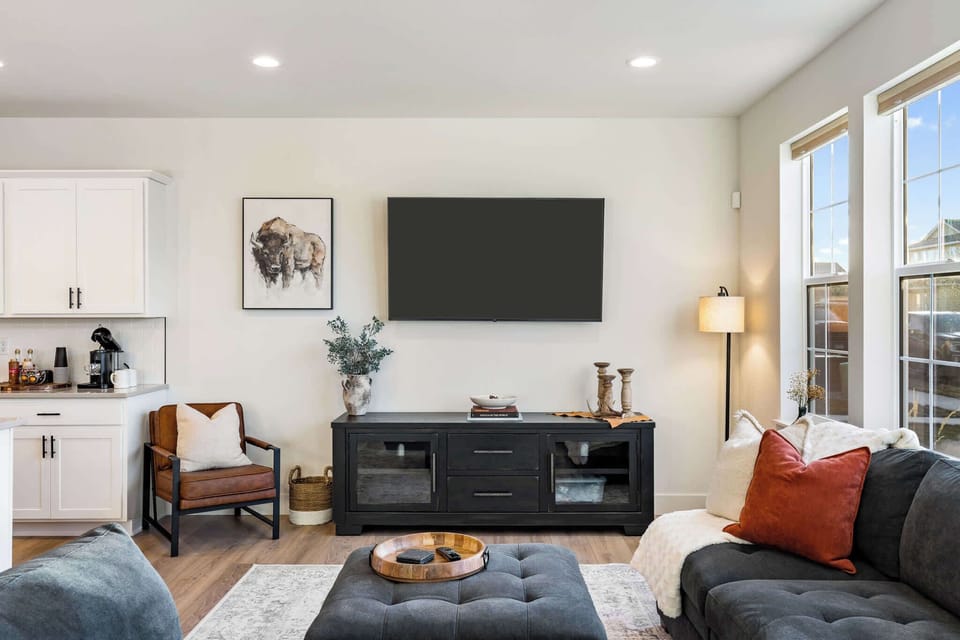 Unwind in the cozy living room featuring a large smart TV, perfect for movie nights, and stylish décor to complement the modern vibe.