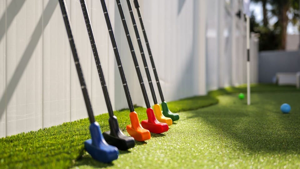Tee up for fun! Our backyard putt-putt green is ready for your best game.